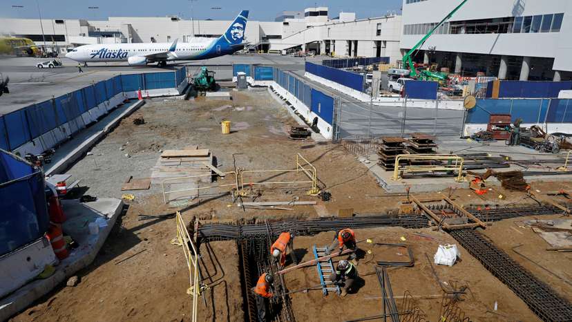 FILE PHOTO: Workers at a construction site at Los Angeles International Airport (LAX)