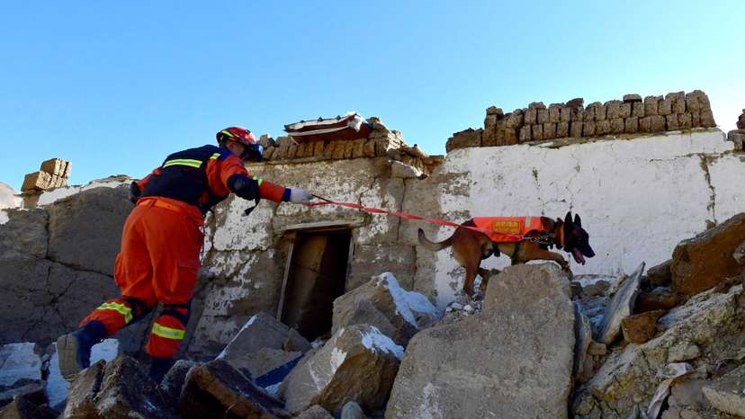 Firefighter conducts search and rescue operation after earthquake in Tibet
