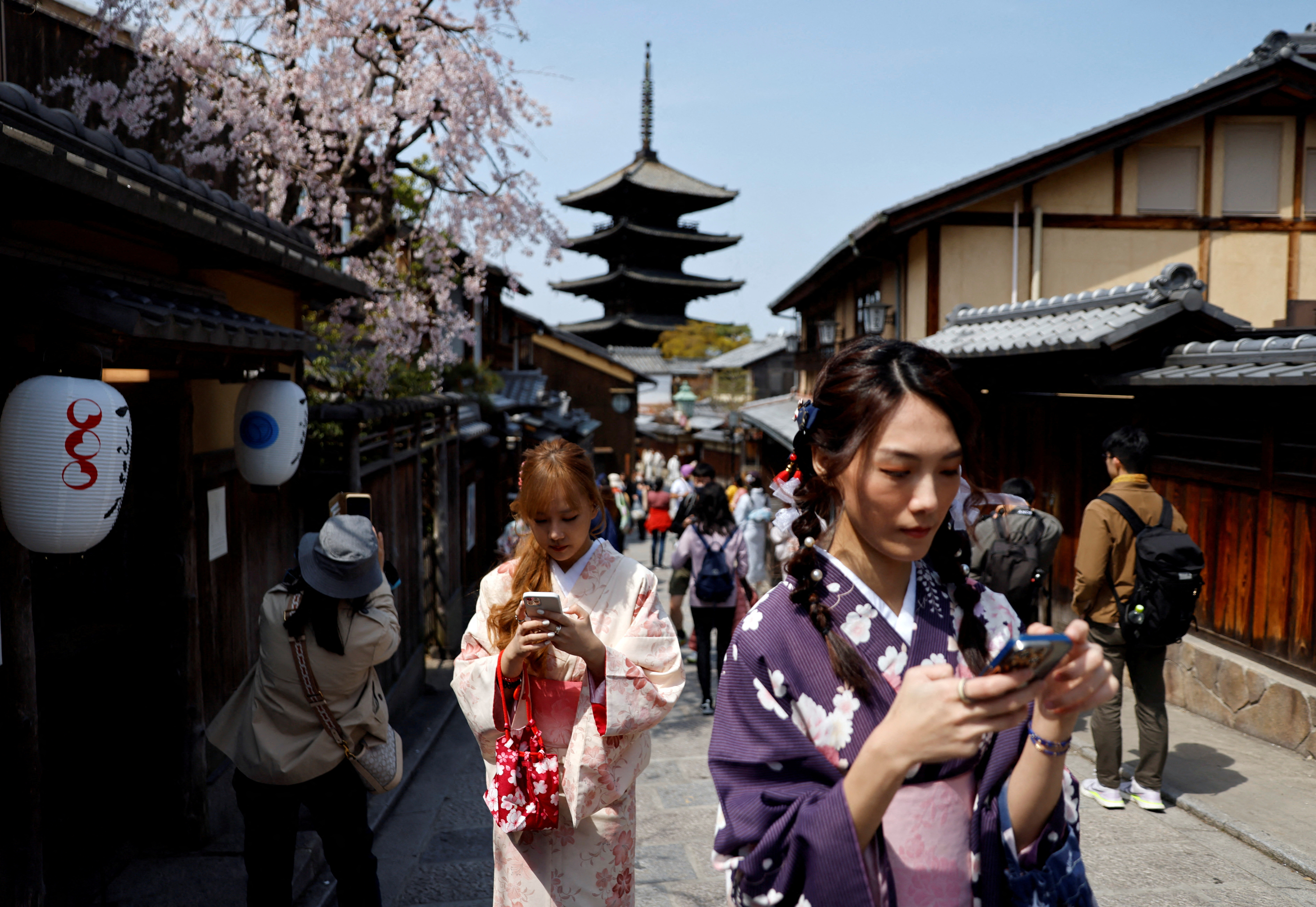 FILE PHOTO: A crowd of tourists walk on the street near Kiyomizu-dera temple in Kyoto
