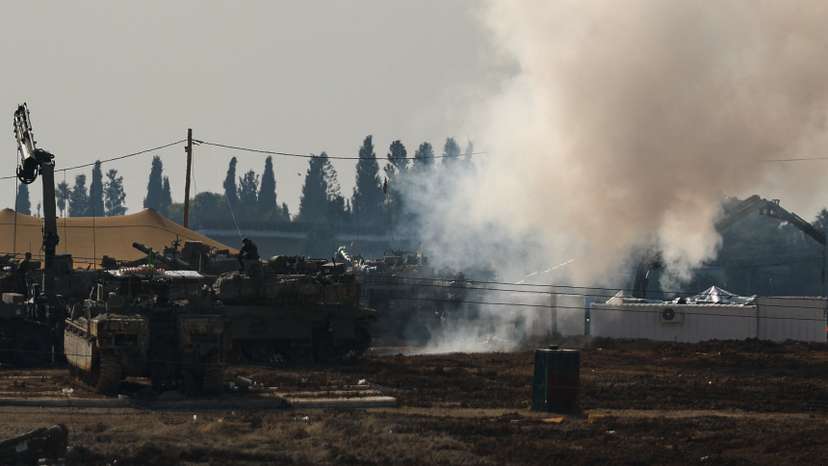 Israeli military vehicles operate, near the Israel-Gaza border, in Israel