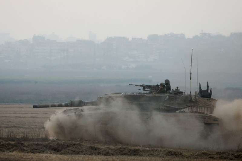 An Israeli tank manoeuvres, amid the Israel-Hamas conflict, near the Israel-Gaza border, in Israel