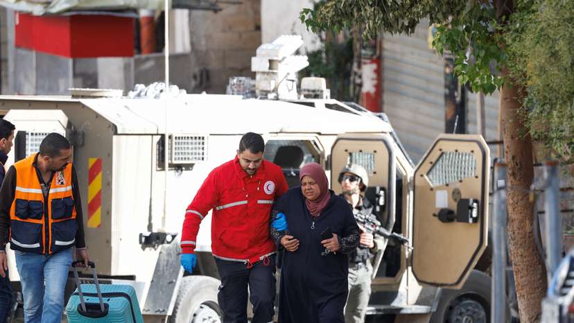 Palestinians walk leaving Ein Beit el Ma refugee camp near Nablus, in the Israeli-occupied West Bank