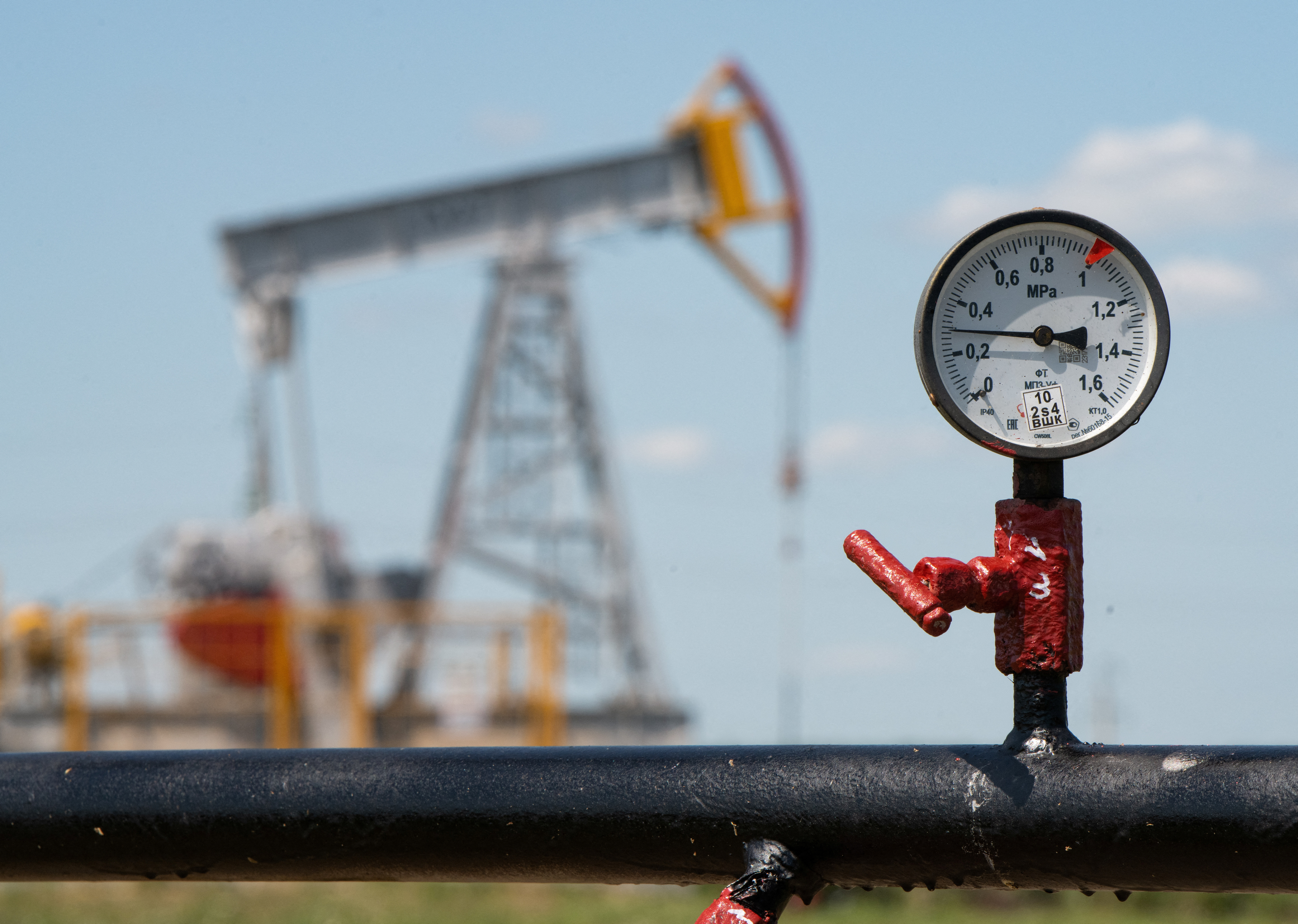 A view shows a pressure gauge near oil pump jacks outside Almetyevsk