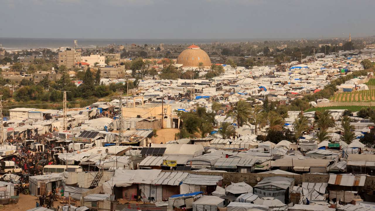 FILE PHOTO: Displaced Palestinians shelter at a tent camp in Khan Younis