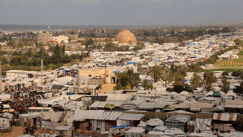 FILE PHOTO: Displaced Palestinians shelter at a tent camp in Khan Younis
