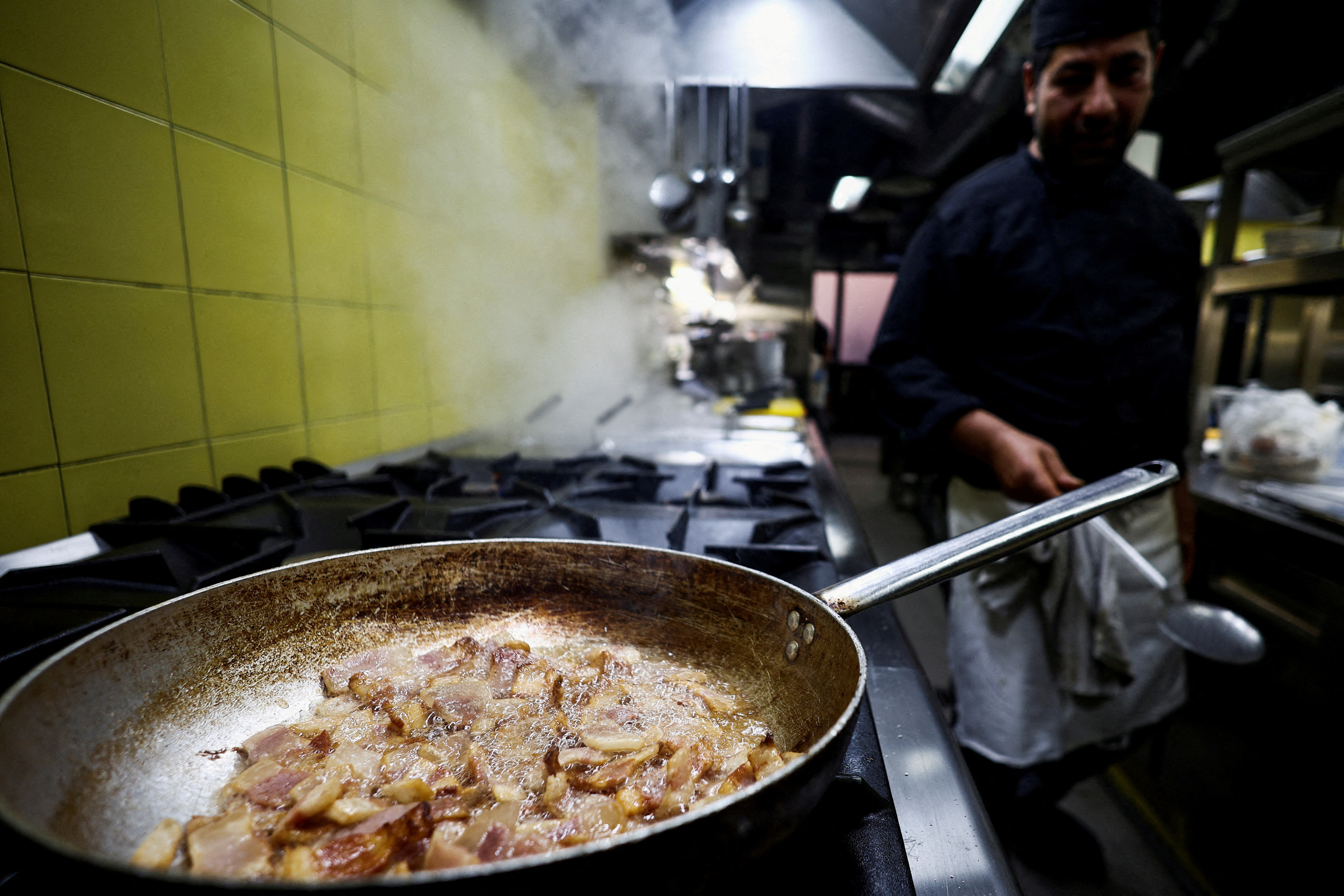 FILE PHOTO: A cook prepares pasta Carbonara at "La Carbonara" restaurant in Campo de' Fiori in Rome