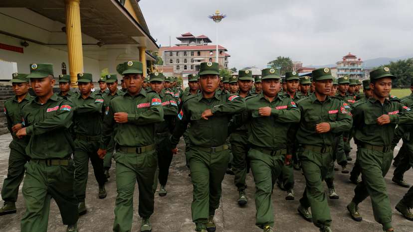 United Wa State Army (UWSA) soldiers march during a media display in Pansang, Wa territory in northeast Myanmar