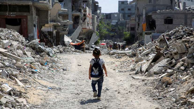 Gaza teacher welcomes students in a classroom tent set up on the rubble of her house