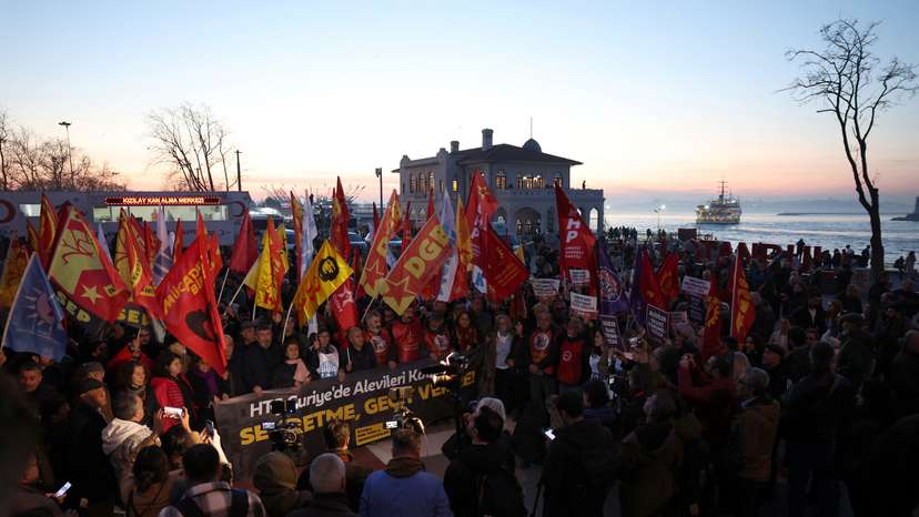 People gather to protest against the violence in Syria and voice support for Alawites, in Istanbul
