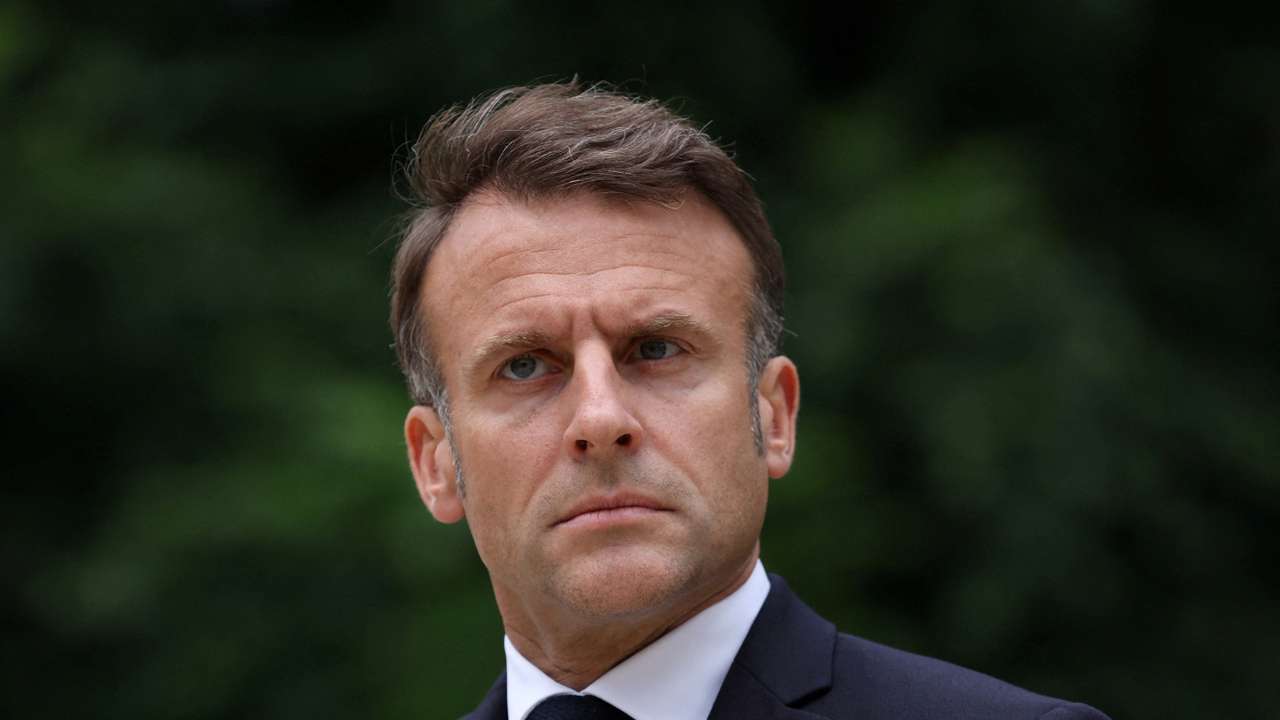 FILE PHOTO: French President Emmanuel Macron reviews troops that will take part in the Bastille Day parade, in Paris