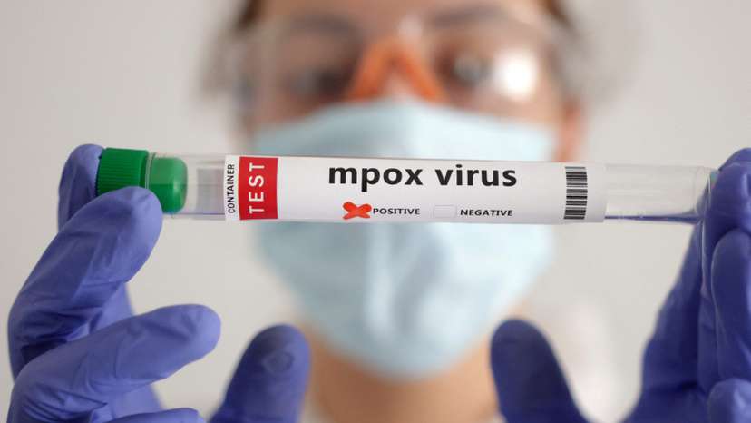 Illustration shows test tubes with "Mpox virus positive" label
