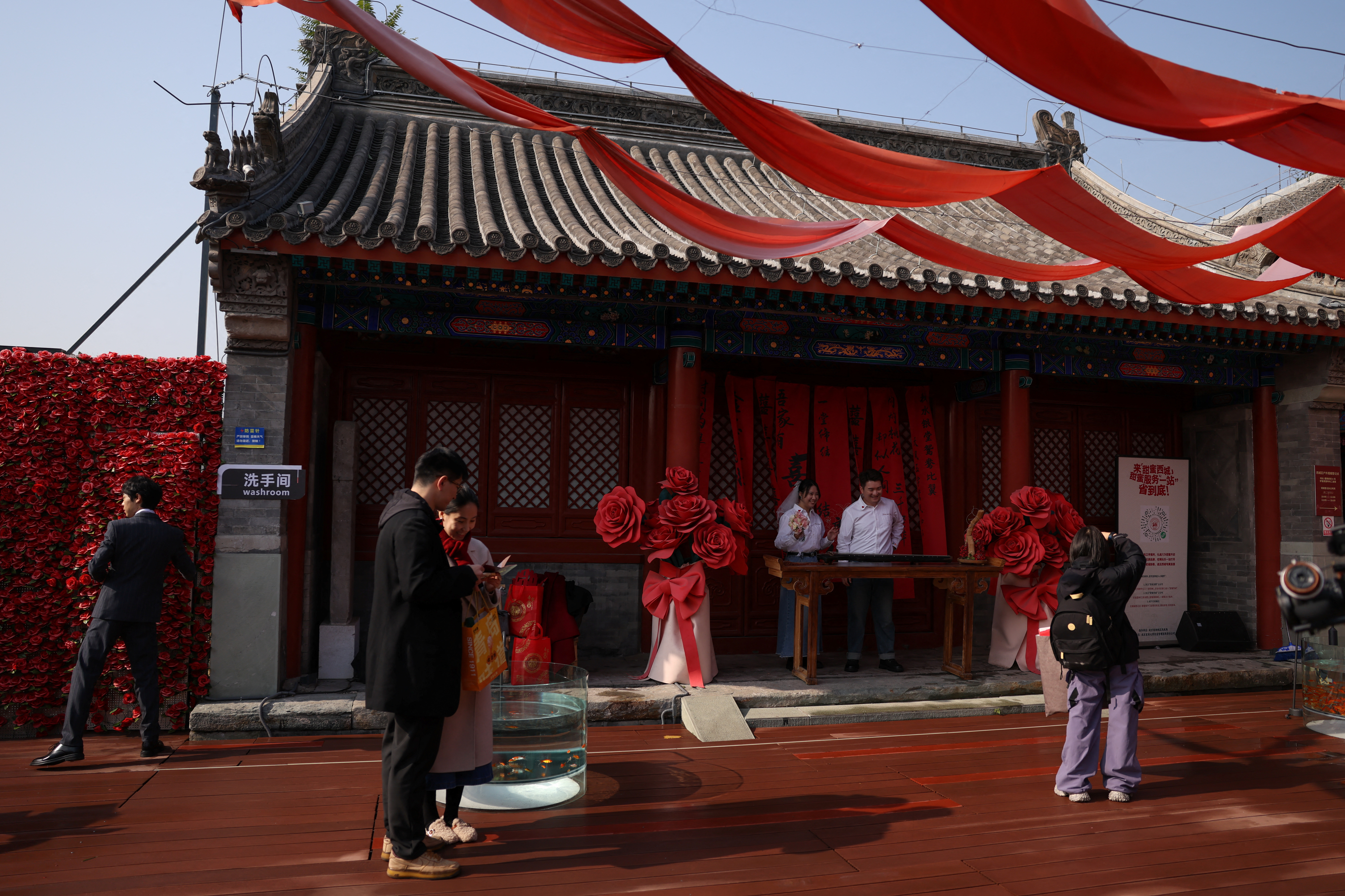 Couple get married at the Huguo Guanyin Temple, in Beijing