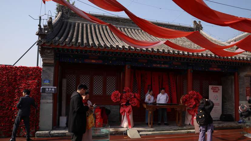 Couple get married at the Huguo Guanyin Temple, in Beijing