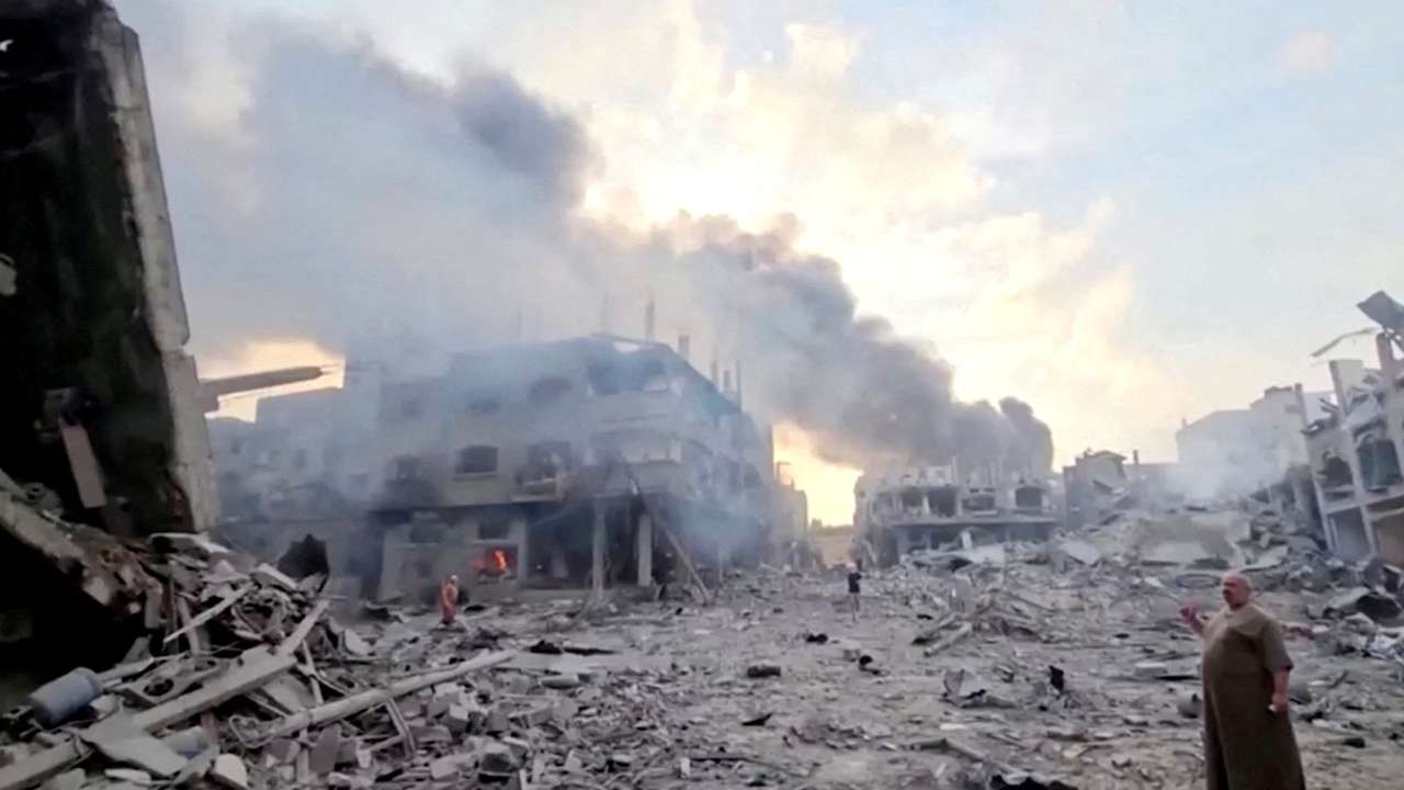 FILE PHOTO: Smoke billows over flattened buildings in Gaza's Jabalia camp