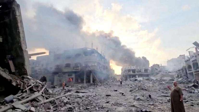 FILE PHOTO: Smoke billows over flattened buildings in Gaza's Jabalia camp