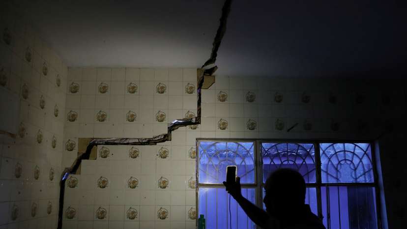 FILE PHOTO: Jose Rinaldo Januario shows a damage in his house linked to rock salt mining by the petrochemical company Braskem in Maceio