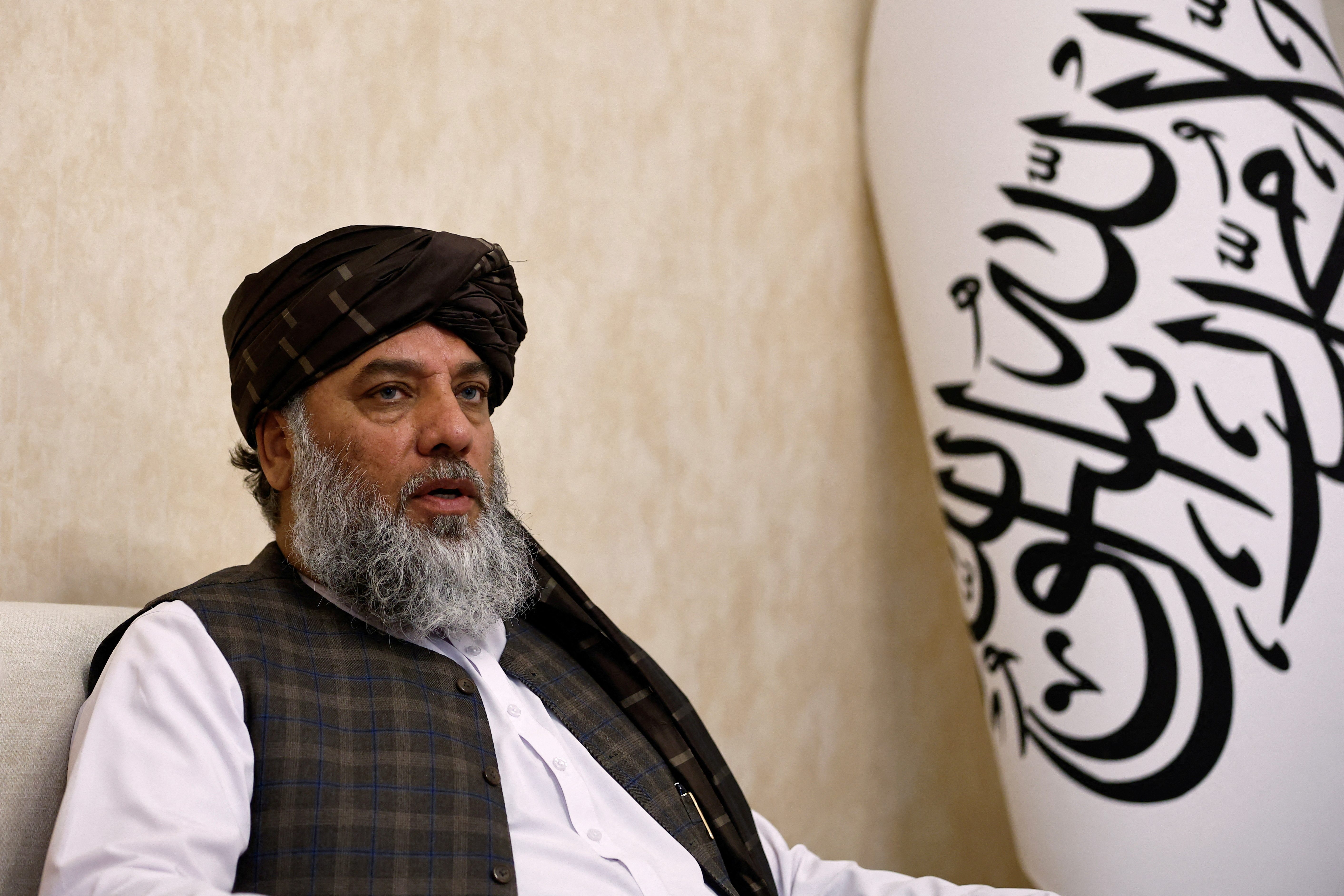 FILE PHOTO: Taliban's acting commerce minister Haji Nooruddin Azizi speaks during an interview with Reuters, at the Embassy of Afghanistan in Beijing