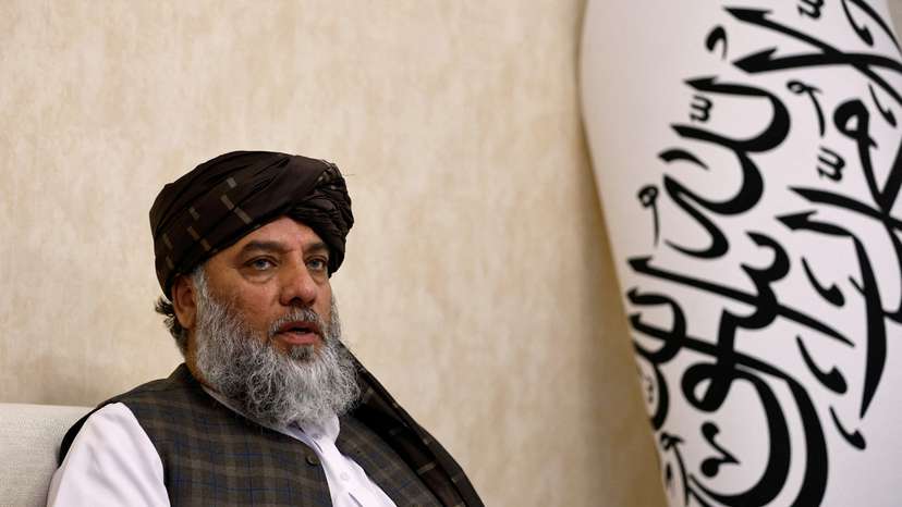 FILE PHOTO: Taliban's acting commerce minister Haji Nooruddin Azizi speaks during an interview with Reuters, at the Embassy of Afghanistan in Beijing