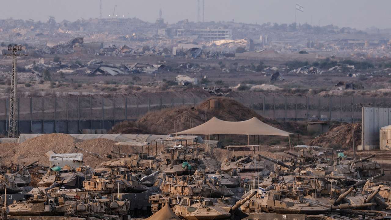 Israeli tanks stand on the Israeli side of the border with Gaza, in Israel