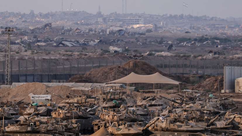 Israeli tanks stand on the Israeli side of the border with Gaza, in Israel