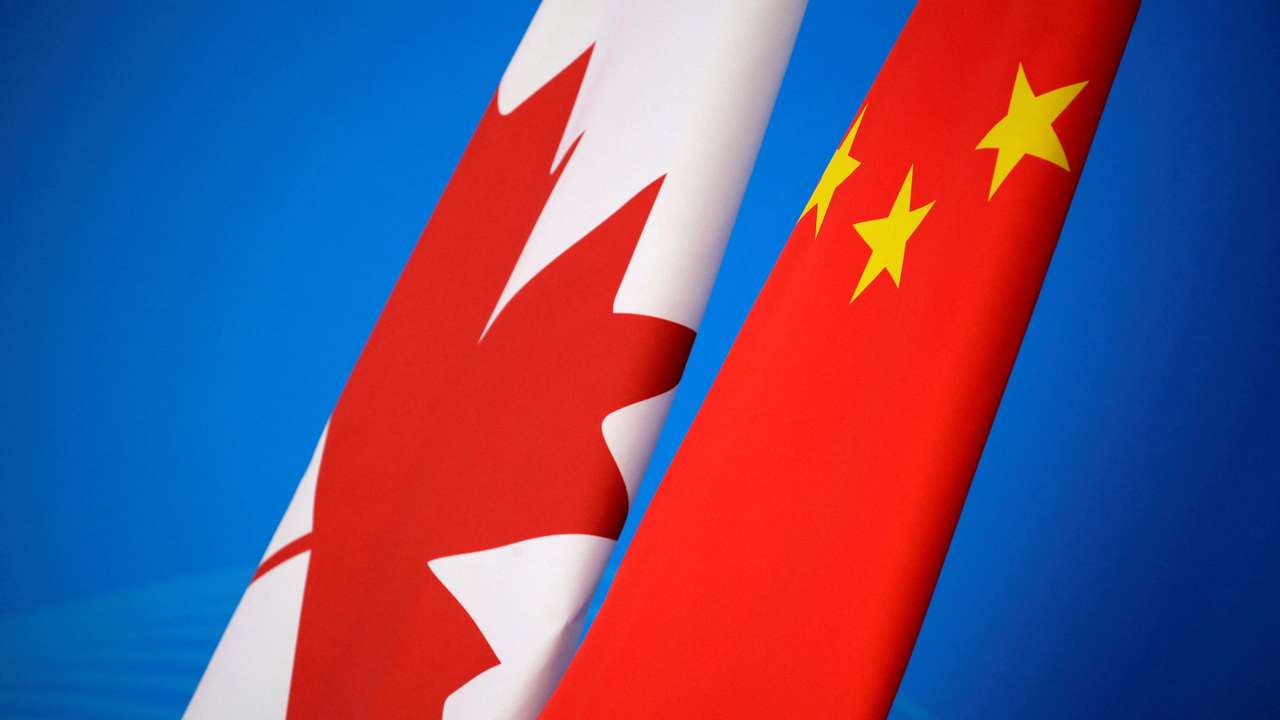 FILE PHOTO: Flags of Canada and China are placed for the first China-Canada economic and financial strategy dialogue in Beijing