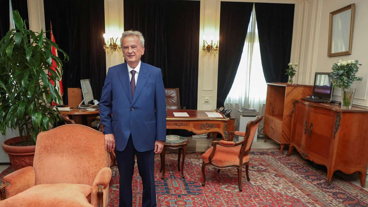 FILE PHOTO: Longtime chief of Lebanon's Central Bank Riad Salameh, poses as he leaves office after a 30-year tenure, at Lebanon's Central Bank building in Beirut