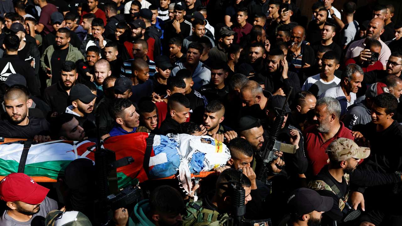 People attend the funeral of five Palestinian fighters who were killed in an Israeli air strike in the Balata Camp, in Nablus