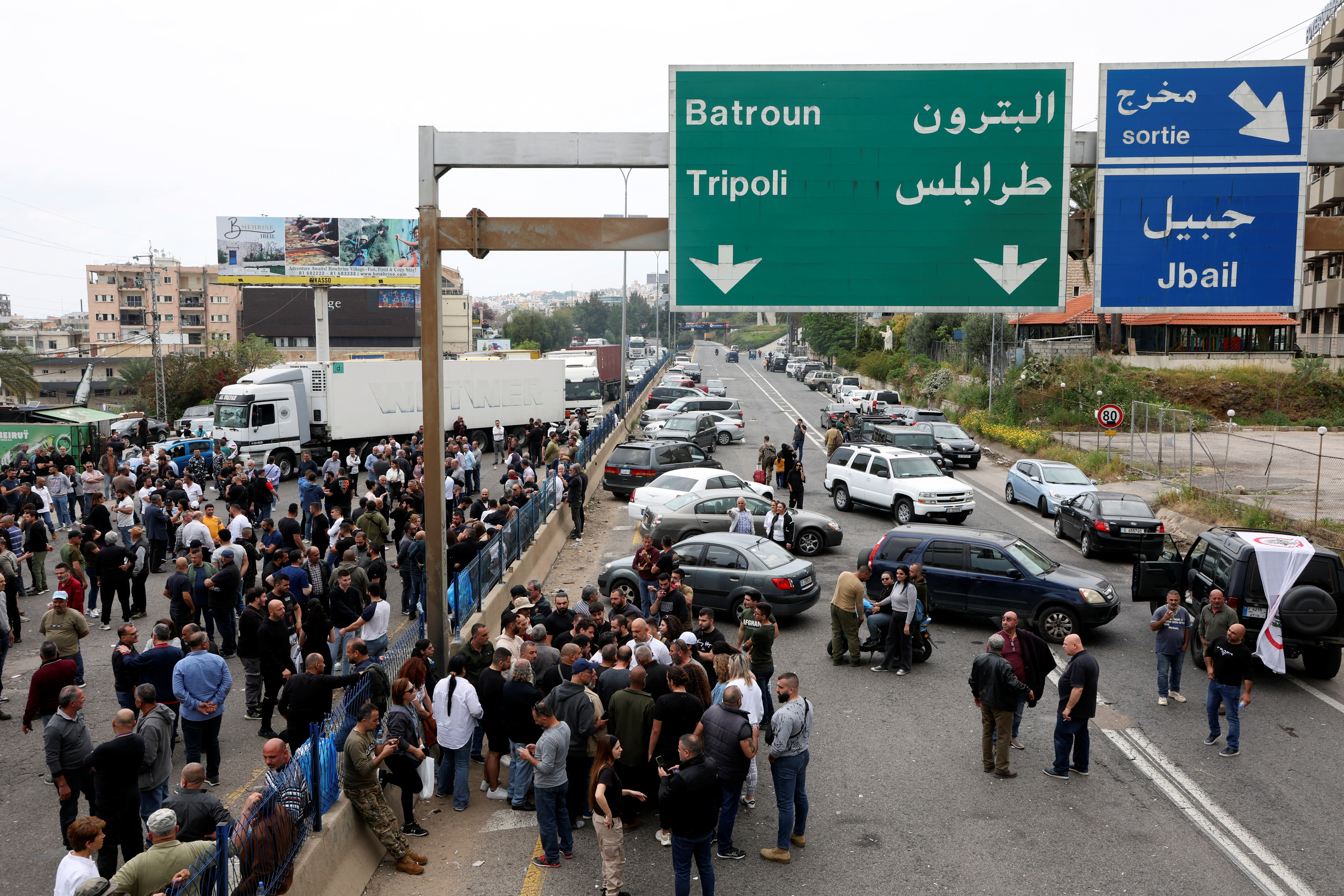 Supporters of the Lebanese Forces Party block a main highway in Byblos
