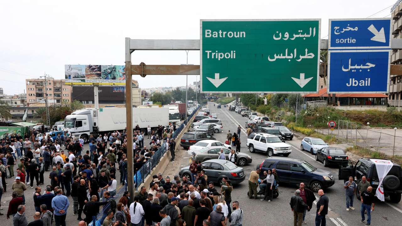 Supporters of the Lebanese Forces Party block a main highway in Byblos