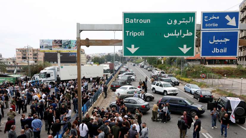 Supporters of the Lebanese Forces Party block a main highway in Byblos