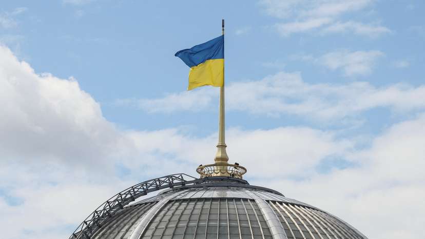 Ukrainian flag over parliament building in Kyiv