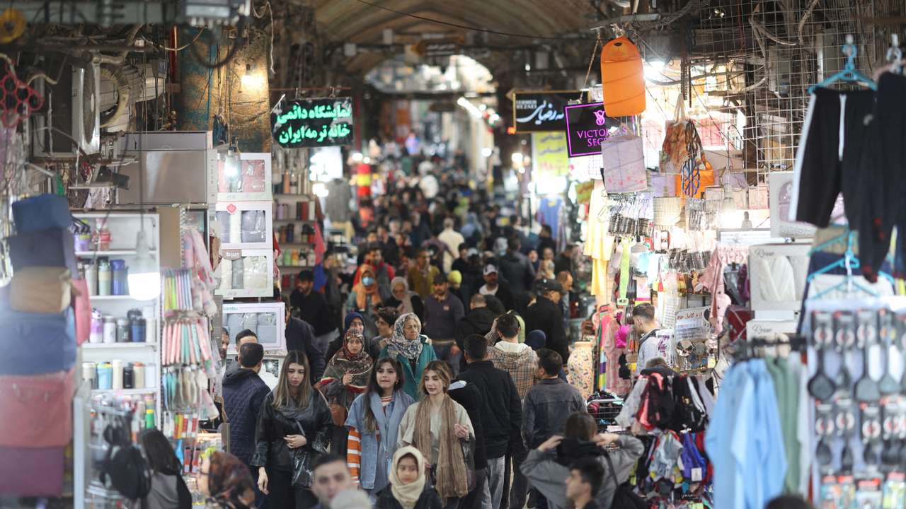FILE PHOTO: Iranian people shop at the Tehran Bazaar in Tehran