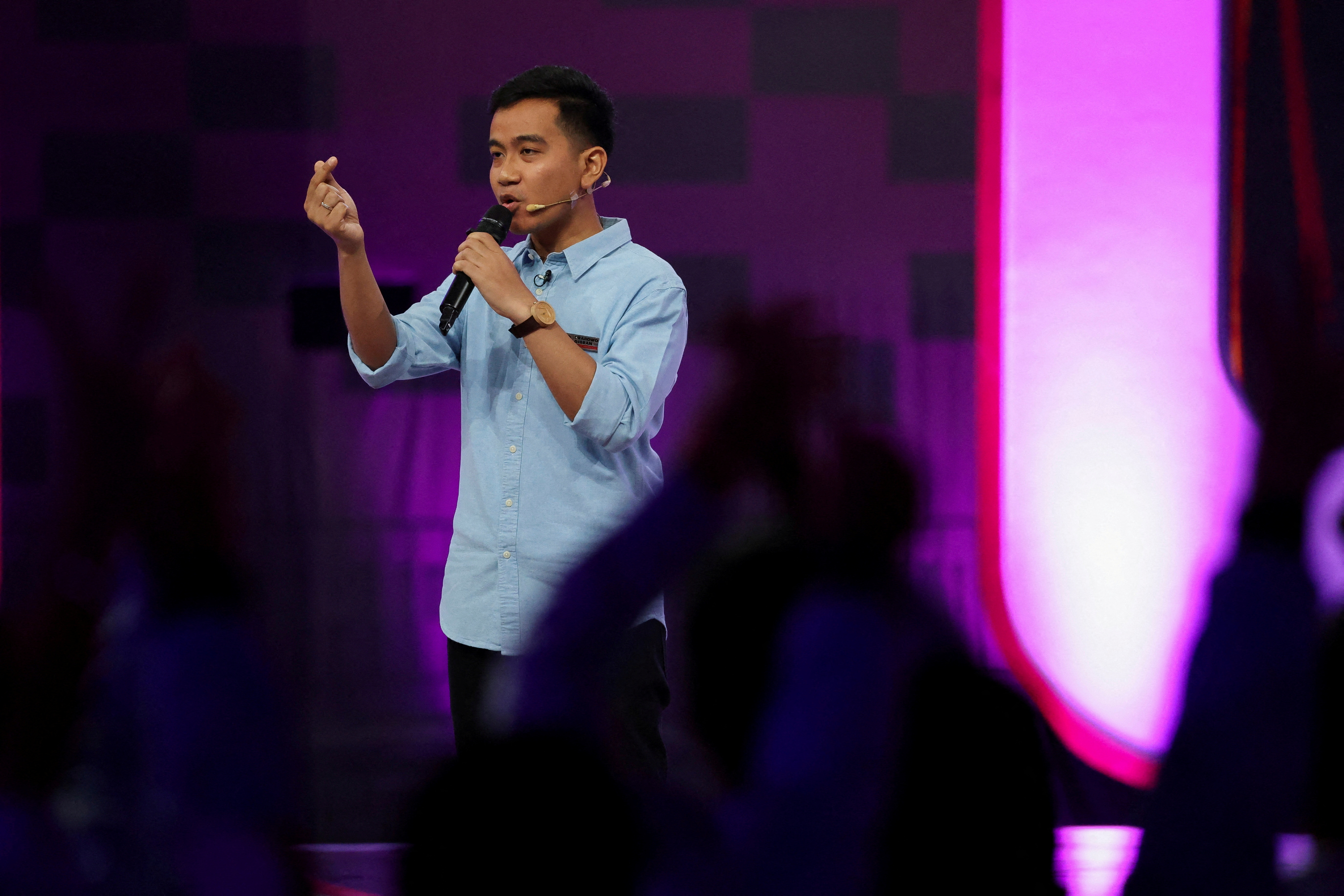 FILE PHOTO: The eldest son of Indonesian President Joko Widodo, vice presidential candidate Gibran Rakabuming Raka, gestures during a televised debate at the Jakarta Convention Center in Jakarta