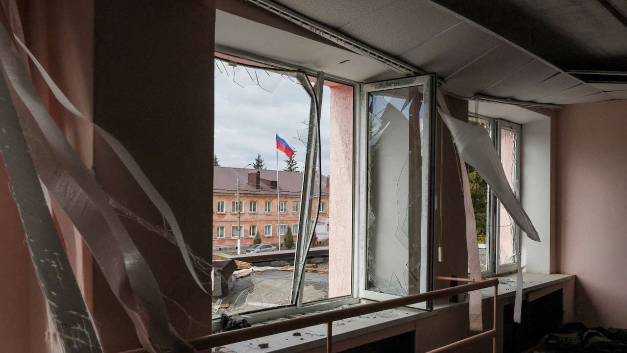 FILE PHOTO: A Russian flag flies in front of a culture centre damaged by a missile attack in the town of Rylsk