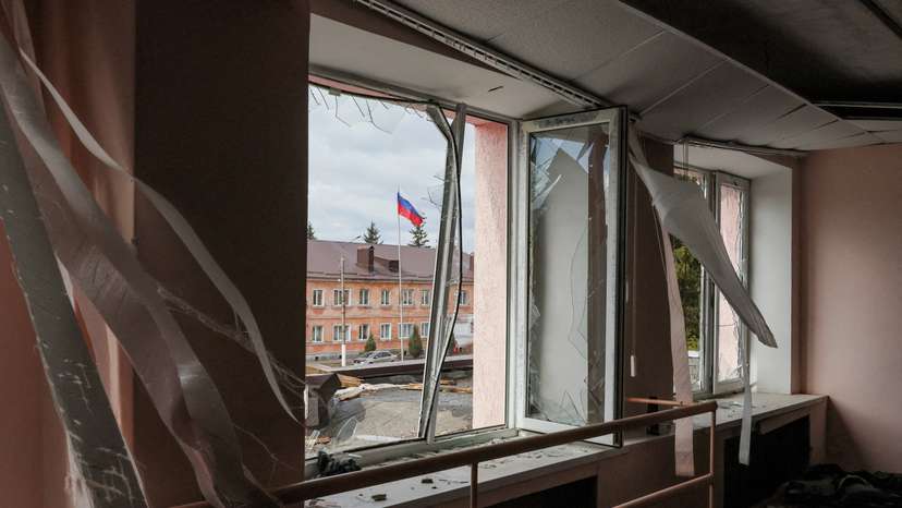 FILE PHOTO: A Russian flag flies in front of a culture centre damaged by a missile attack in the town of Rylsk