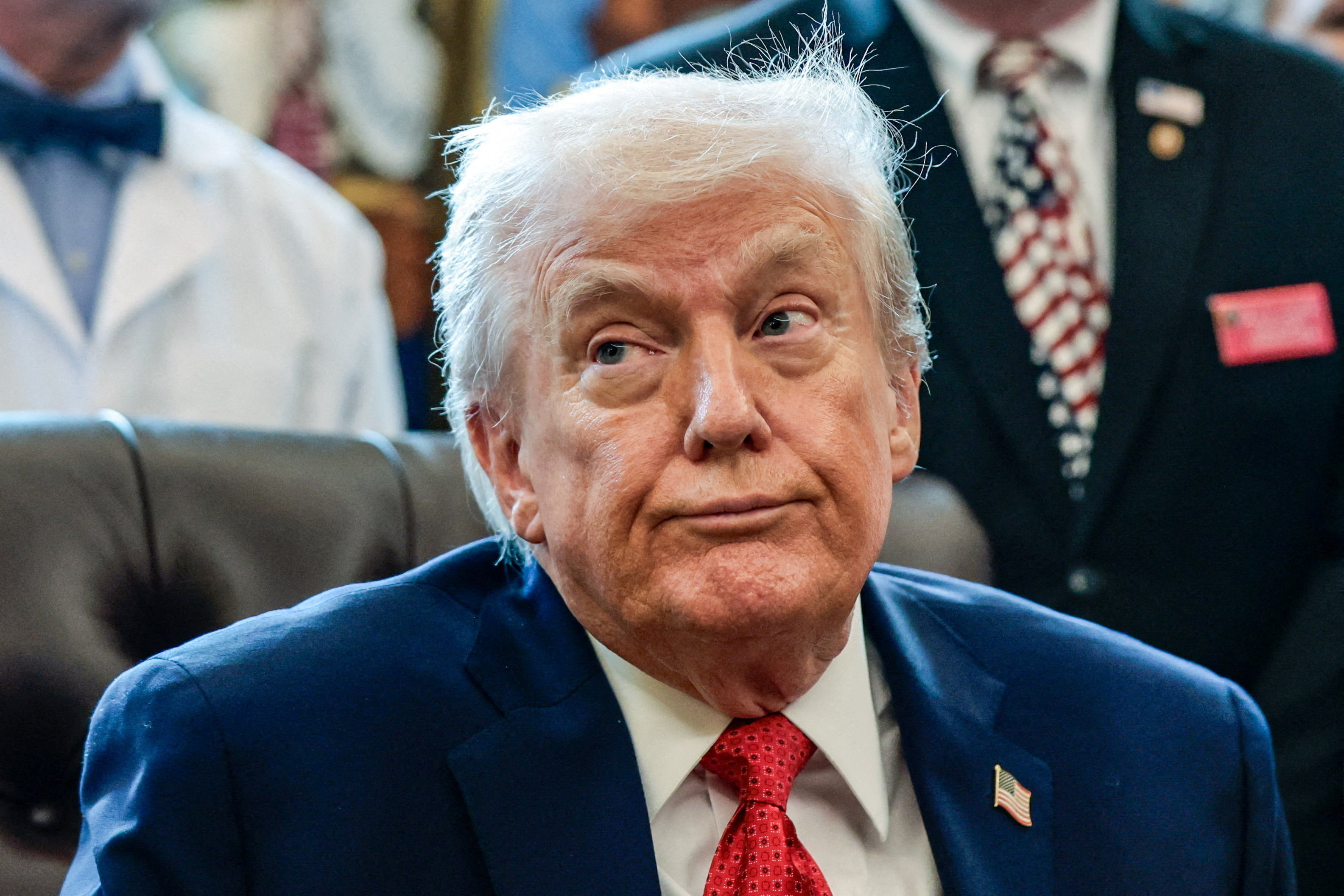 U.S. President Trump signs executive orders at the Oval Office, in Washington