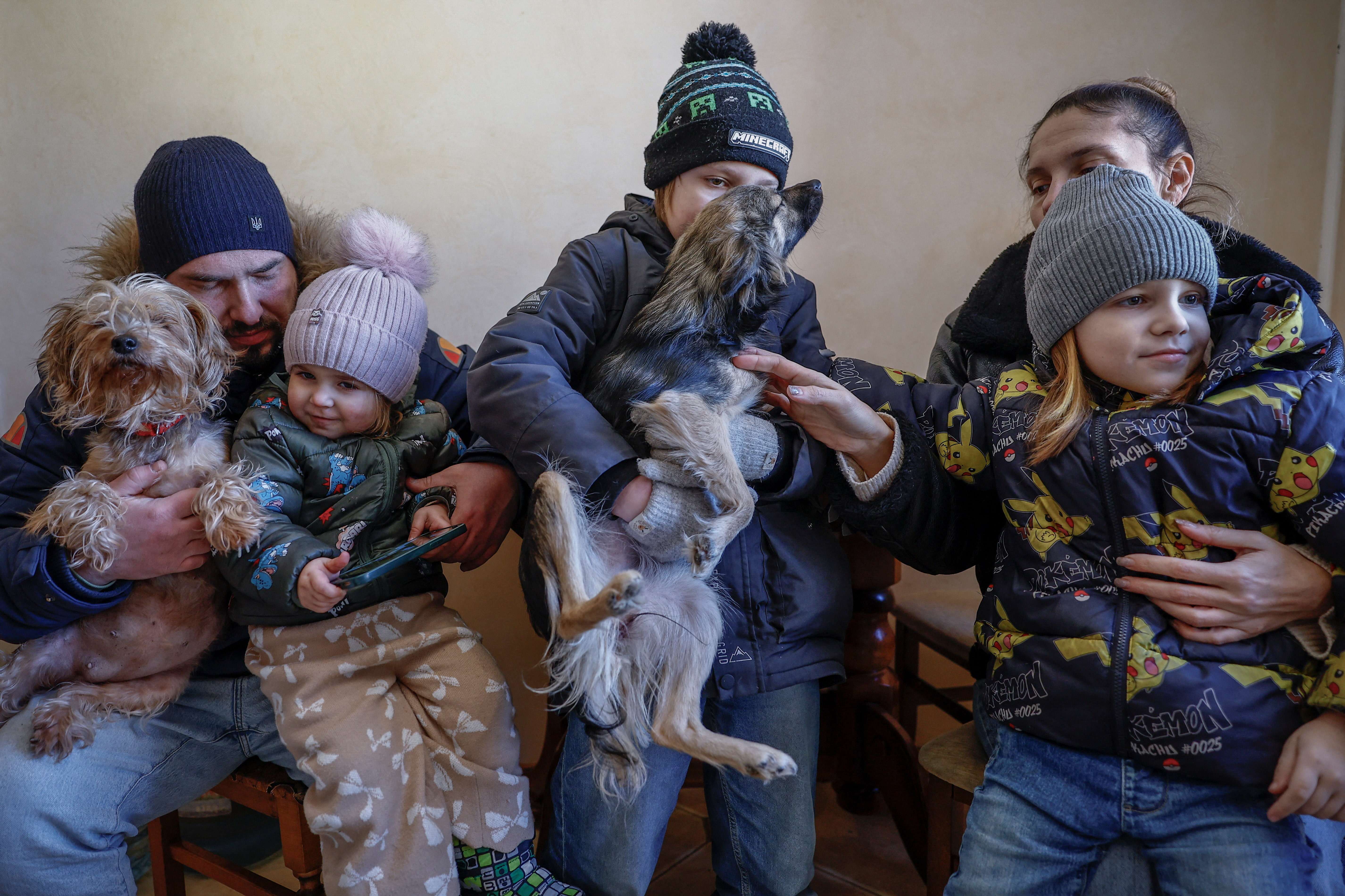 The Wider Image: A young Kyiv family adapts to beat the freeze as Russian attacks