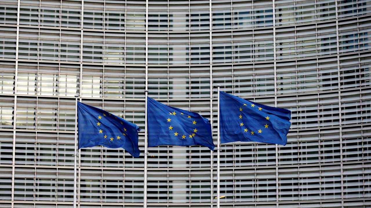 FILE PHOTO: EU flags flutter outside the EU Commission headquarters in Brussels