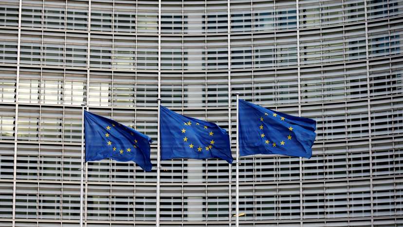 FILE PHOTO: EU flags flutter outside the EU Commission headquarters in Brussels