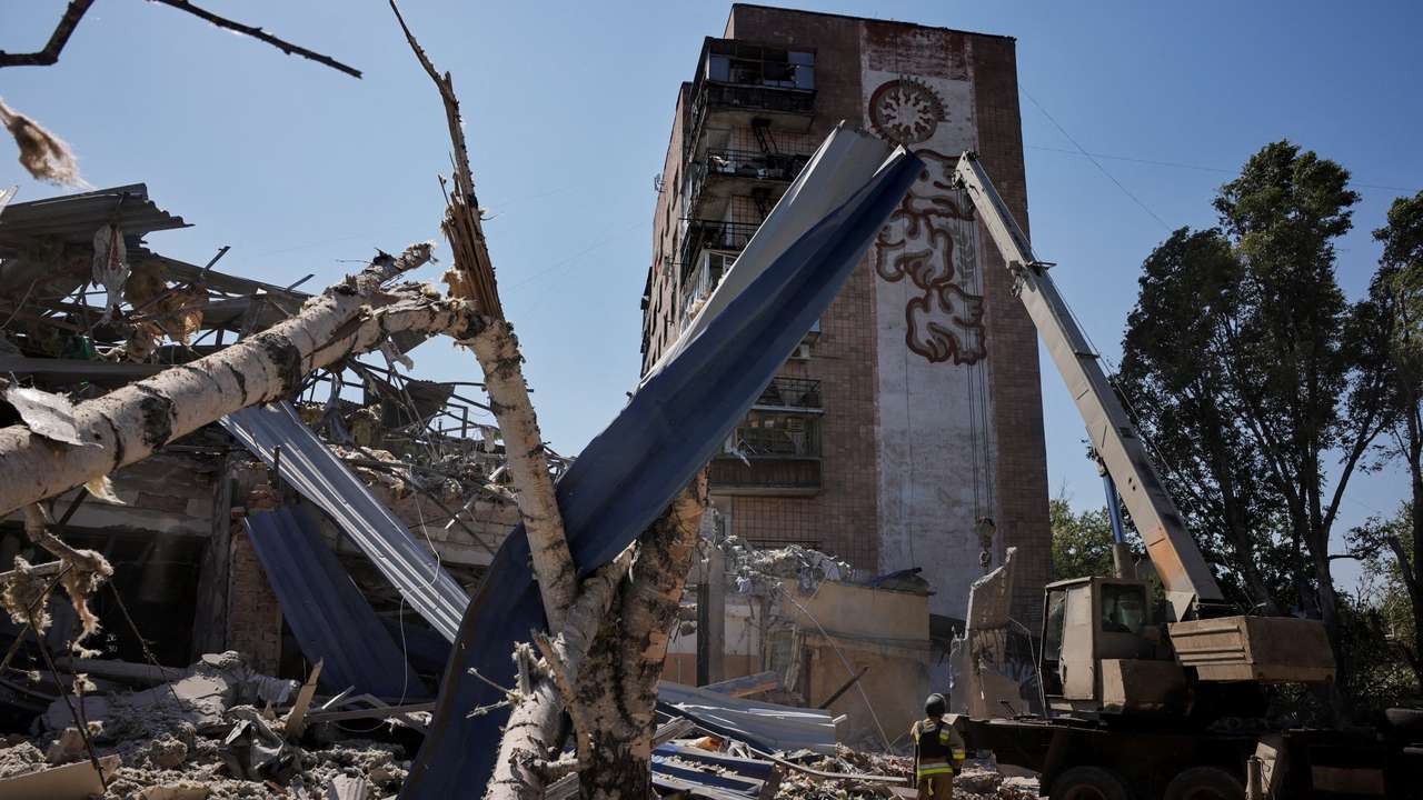 Ukrainian emergency personnel work among the rubble of a destroyed hotel following a Russian strike, in Kramatorsk