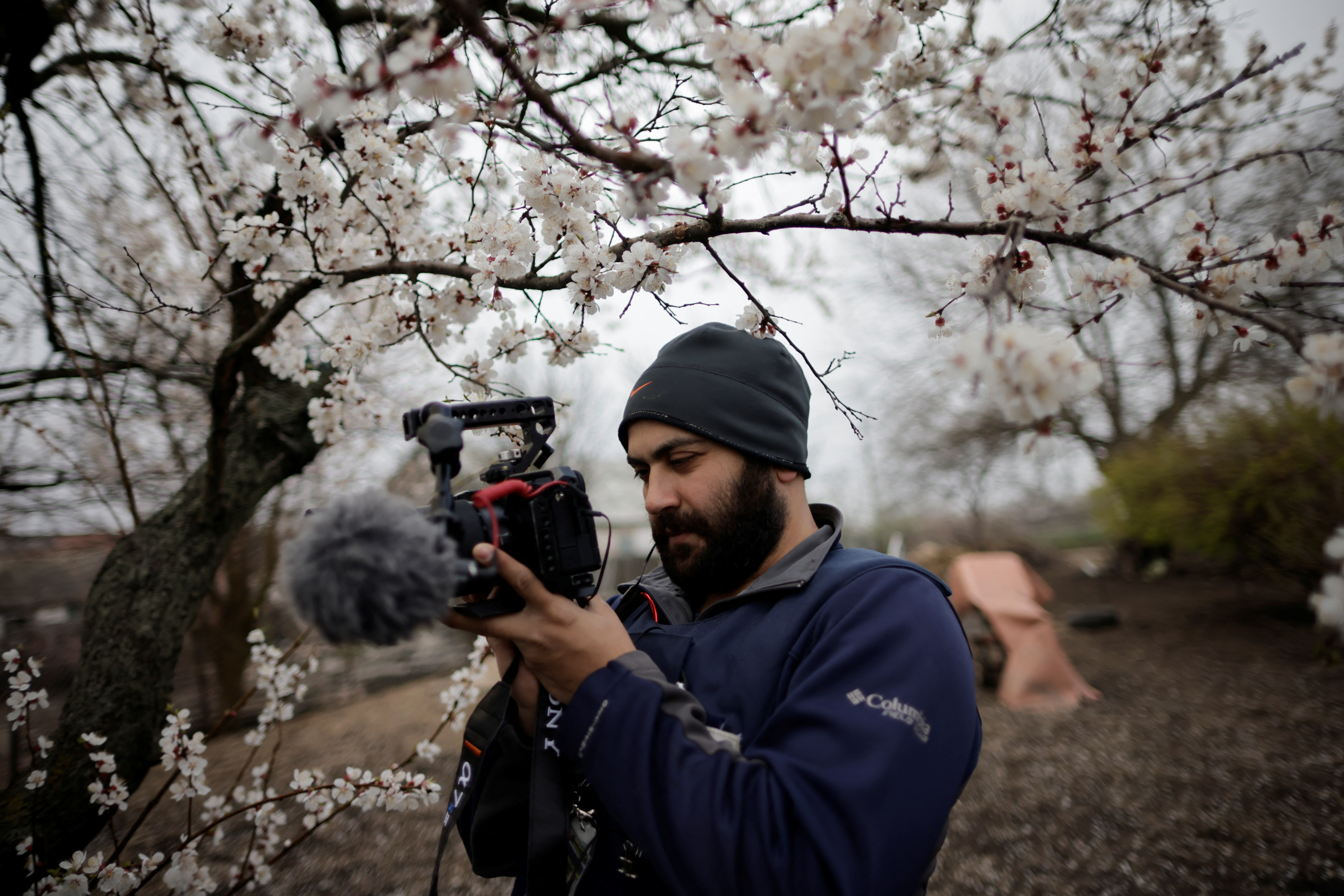 Reuters' journalist Issam Abdallah films Ukrainian woman Zhanna Lishchynska (not pictured) during an interview with Reuters, in Zaporizhzhya