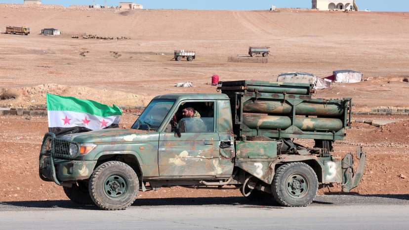 A military vehicle of the Syrian army is parked on the highway near Tabqa