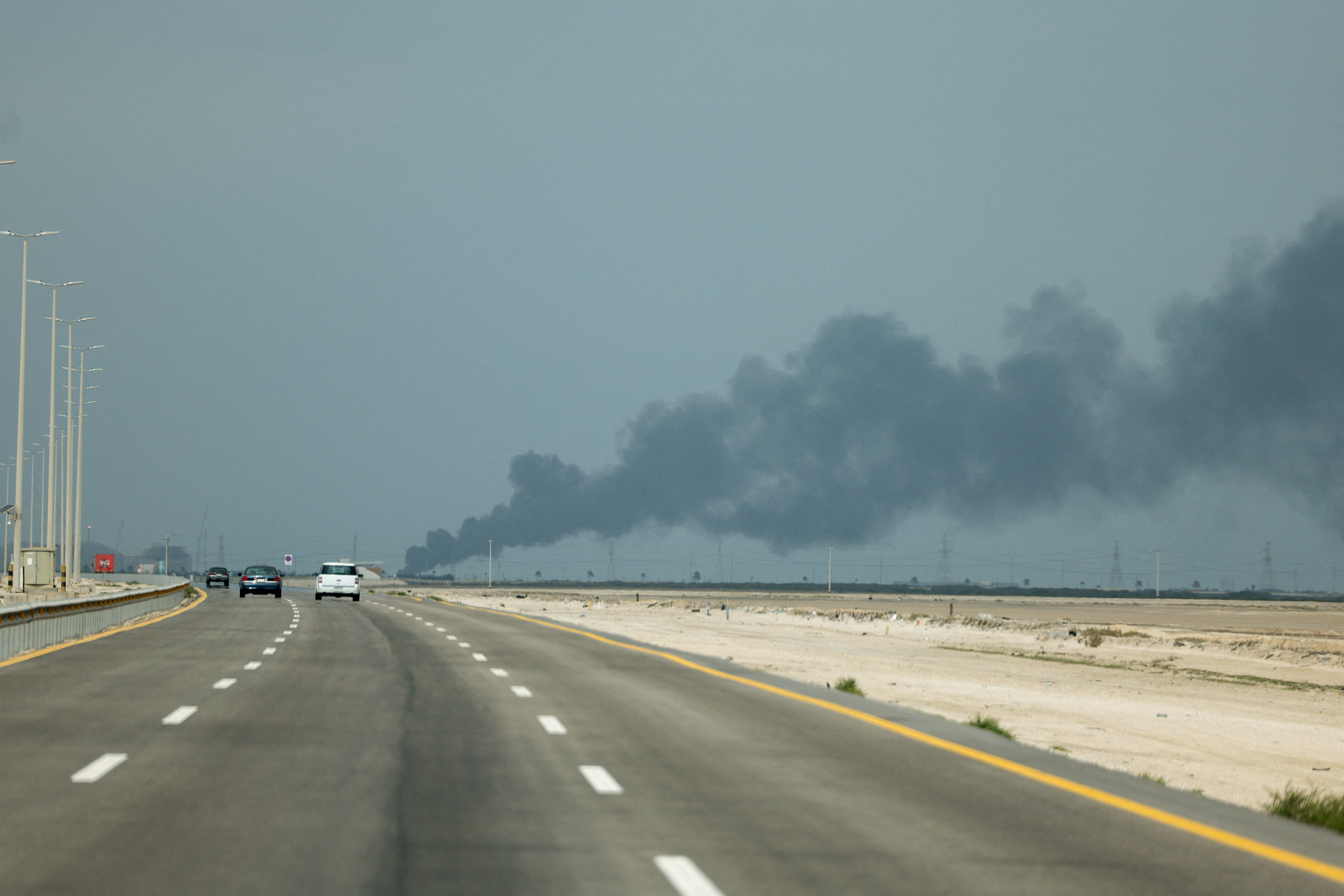 FILE PHOTO: Smoke billows from Saudi Aramco's Ras Tanura oil refinery after a reported Iranian drone strike