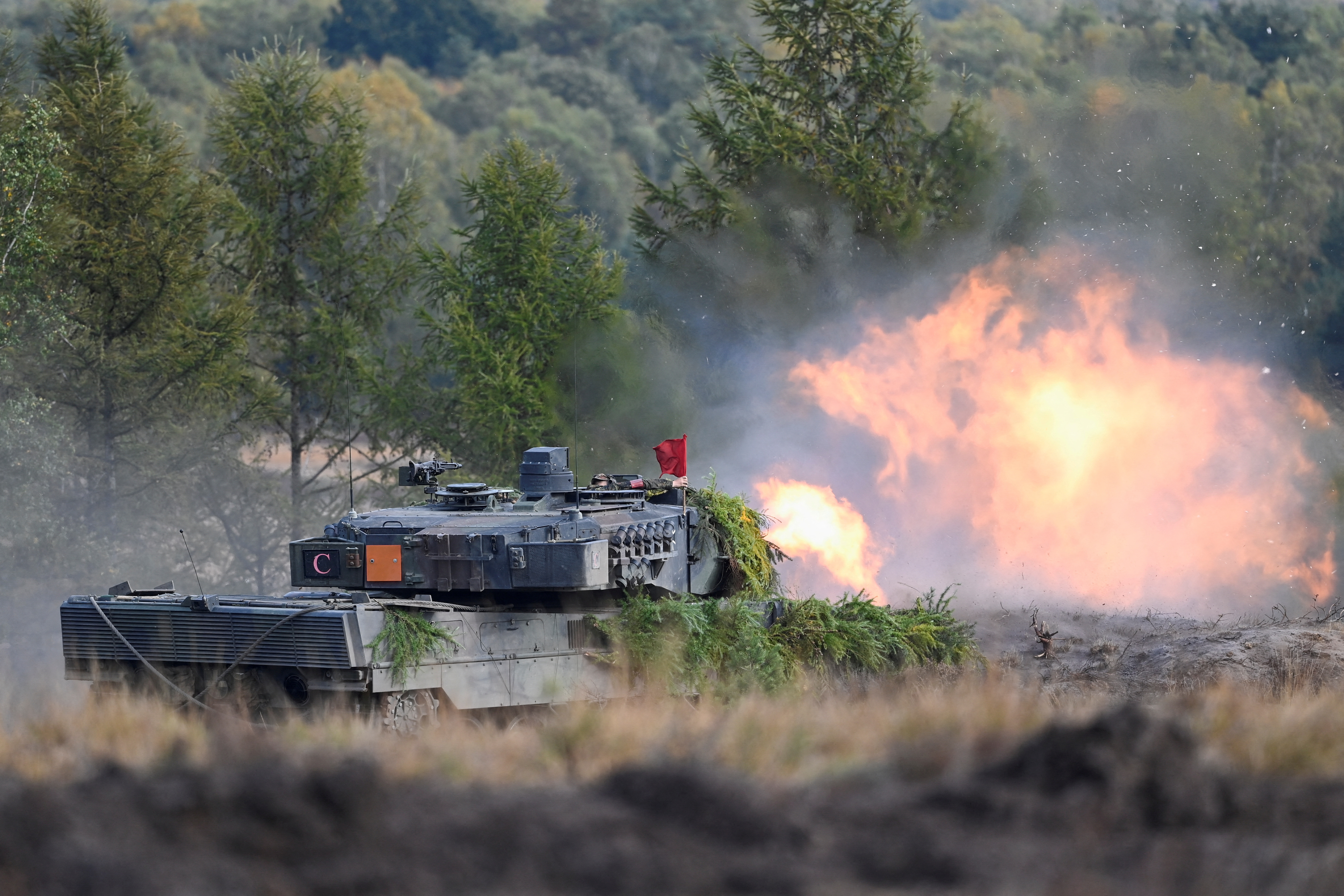FILE PHOTO: German Chancellor Scholz visits German army training at a military base in Bergen