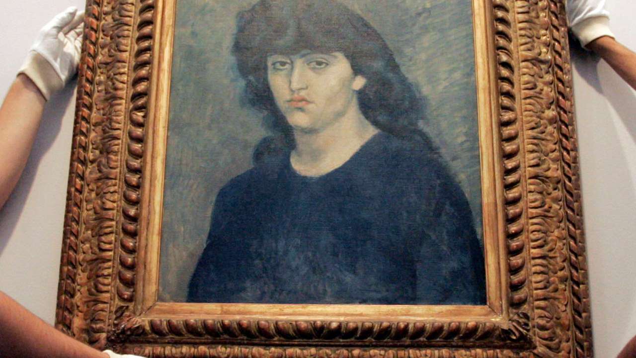 Sao Paulo Museum of Art workers hang Pablo Picasso's oil painting ''Portrait of 'Suzanne Bloch'' before the Museum re-open to visitors