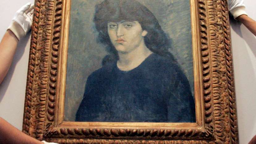 Sao Paulo Museum of Art workers hang Pablo Picasso's oil painting ''Portrait of 'Suzanne Bloch'' before the Museum re-open to visitors