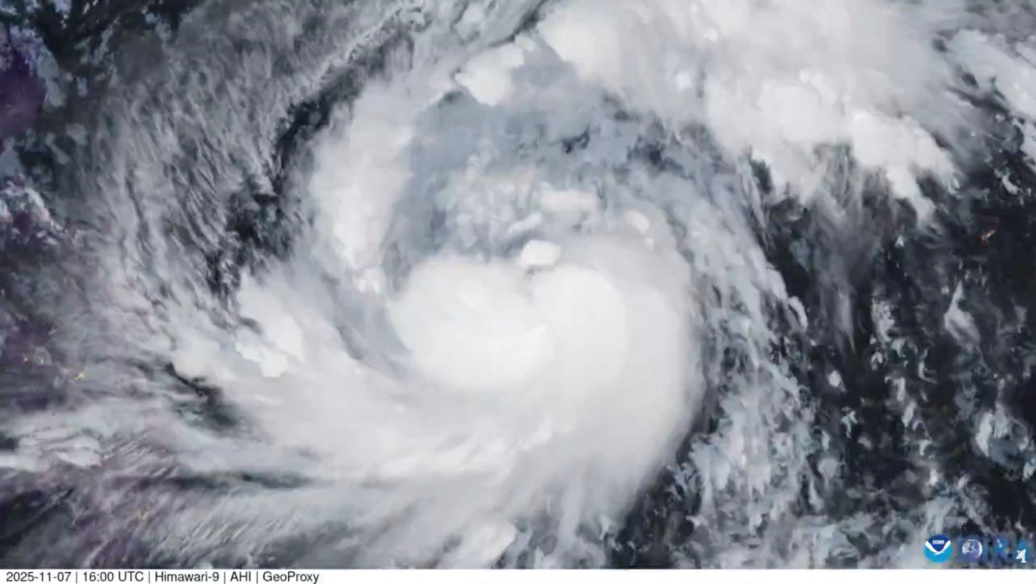 A satellite image shows Storm Fung-Wong, which has intensified into a typhoon
