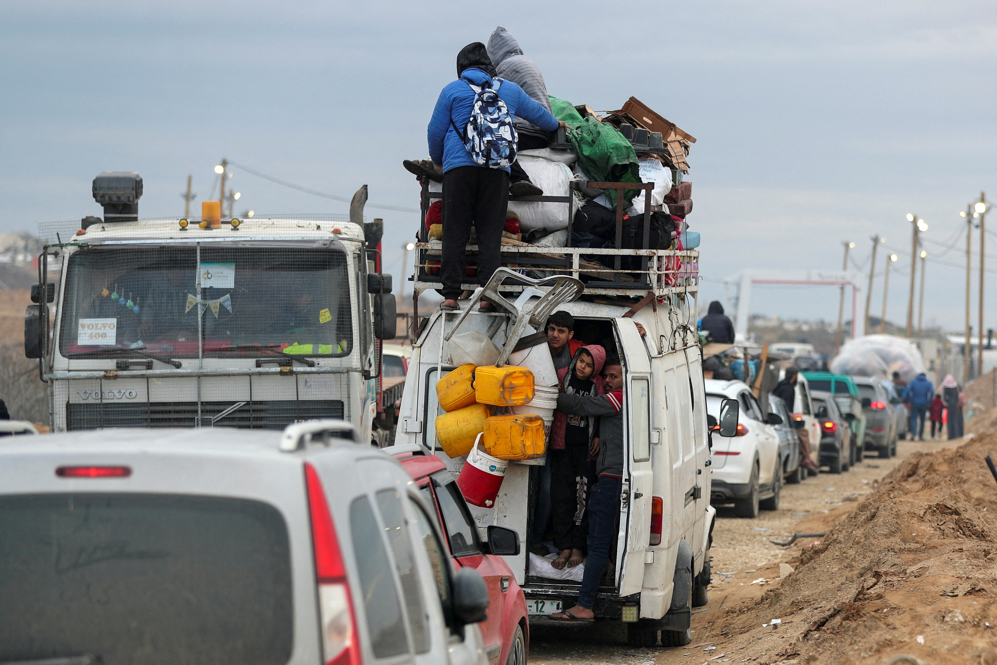 Palestinians make their way after Israeli forces withdrew from the Netzarim Corridor, near Gaza City