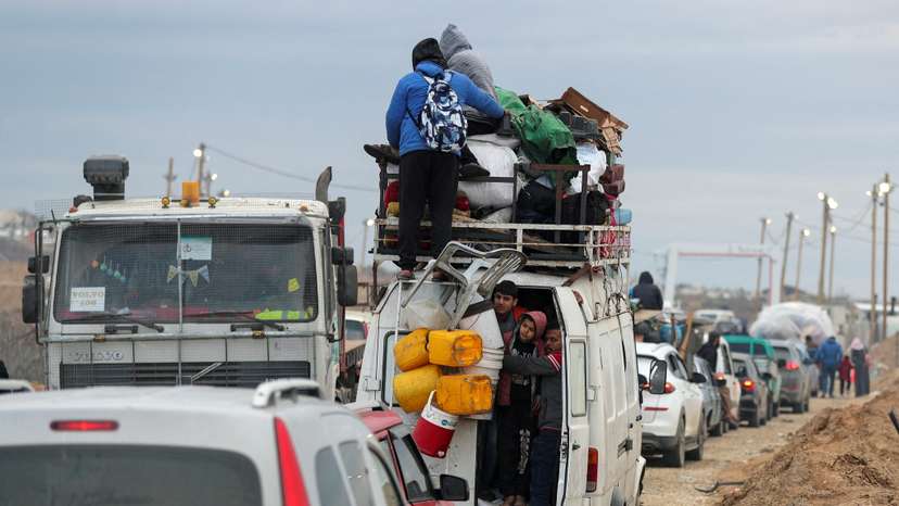 Palestinians make their way after Israeli forces withdrew from the Netzarim Corridor, near Gaza City