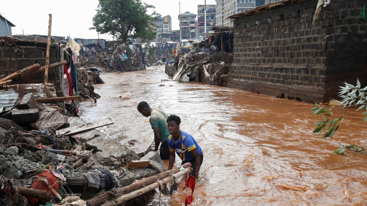 Residents recover their belongings after the Nairobi river burst its banks in the Mathare Valley settlement in Nairobi